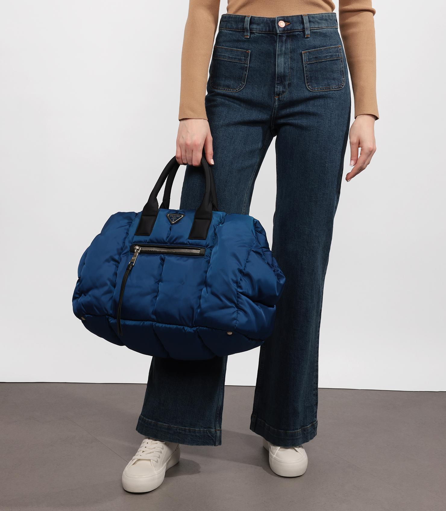 Prada Blue Nylon Tessuto Bomber Tote 

Product Details
Xupes Ref: HB5267
Brand: Prada
Model: Bomber Tote
Type: Tote, Shoulder, Crossbody
Serial Number: Not Present
Age: 2020
RRP: £2,950
Accompanied By: Shoulder Strap
Colour: Blue
Hardware: Silver