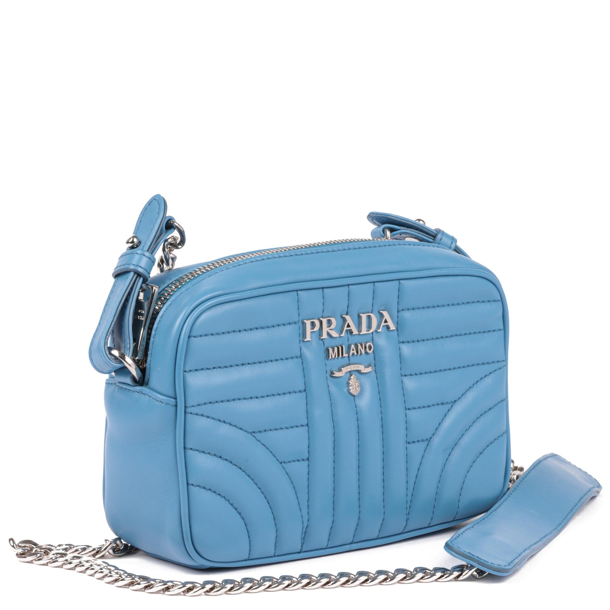 PRADA
Blue Quilted Calfskin Leather Diagramme Camera Bag

Xupes Reference: CB843
Serial Number: 260
Age (Circa): 2018
Accompanied By: Prada Dust Bag, Authenticity Card
Authenticity Details: Date Stamp (Made in Italy)
Gender: Ladies
Type: Shoulder,