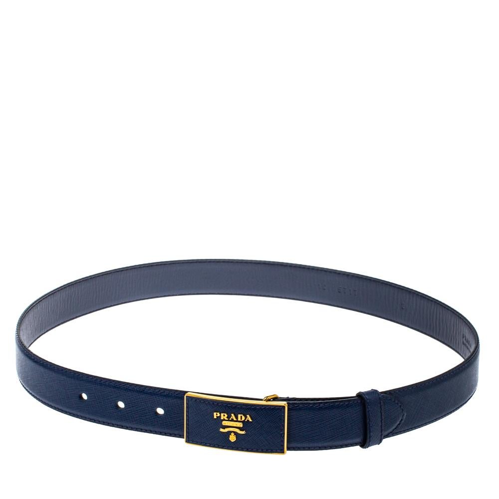 Presenting the finest of Italian craftsmanship even with its accessories—that's Prada! Cut from Saffiano leather, this blue designer belt for women has a rectangular buckle in gold-tone metal as well as leather and it flaunts signature
