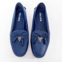 PRADA blue saffiano leather gold logo bow flat tasseled loafers EU36