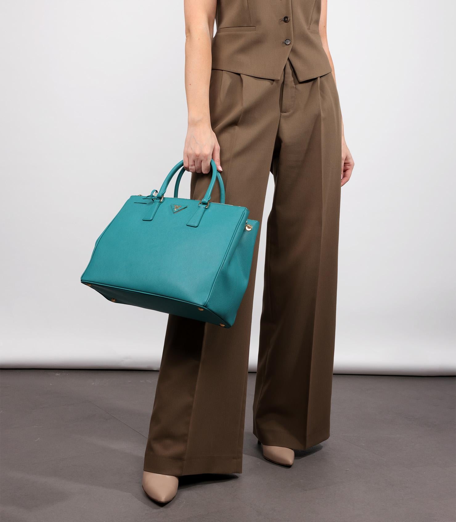 Prada Blue Saffiano Lux Leather Large Galleria Tote

Product Details
Xupes Ref: CB1294
Brand: Prada
Model: Large Galleria Tote
Type: Tote
Serial Number: 180
Age: 2013
RRP: £0
Accompanied By: Prada Dust Bag, Care Booklet, Removable Leather