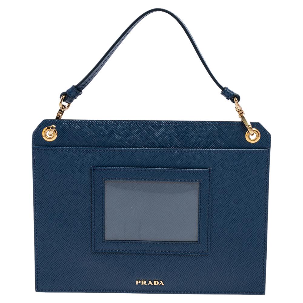 Renowned for its exclusive craftsmanship, this Prada crossbody bag will live up to your expectations. Crafted from Saffiano Lux leather, it comes in a blue hue. It features a nylon interior equipped to house your essentials. It comes with top
