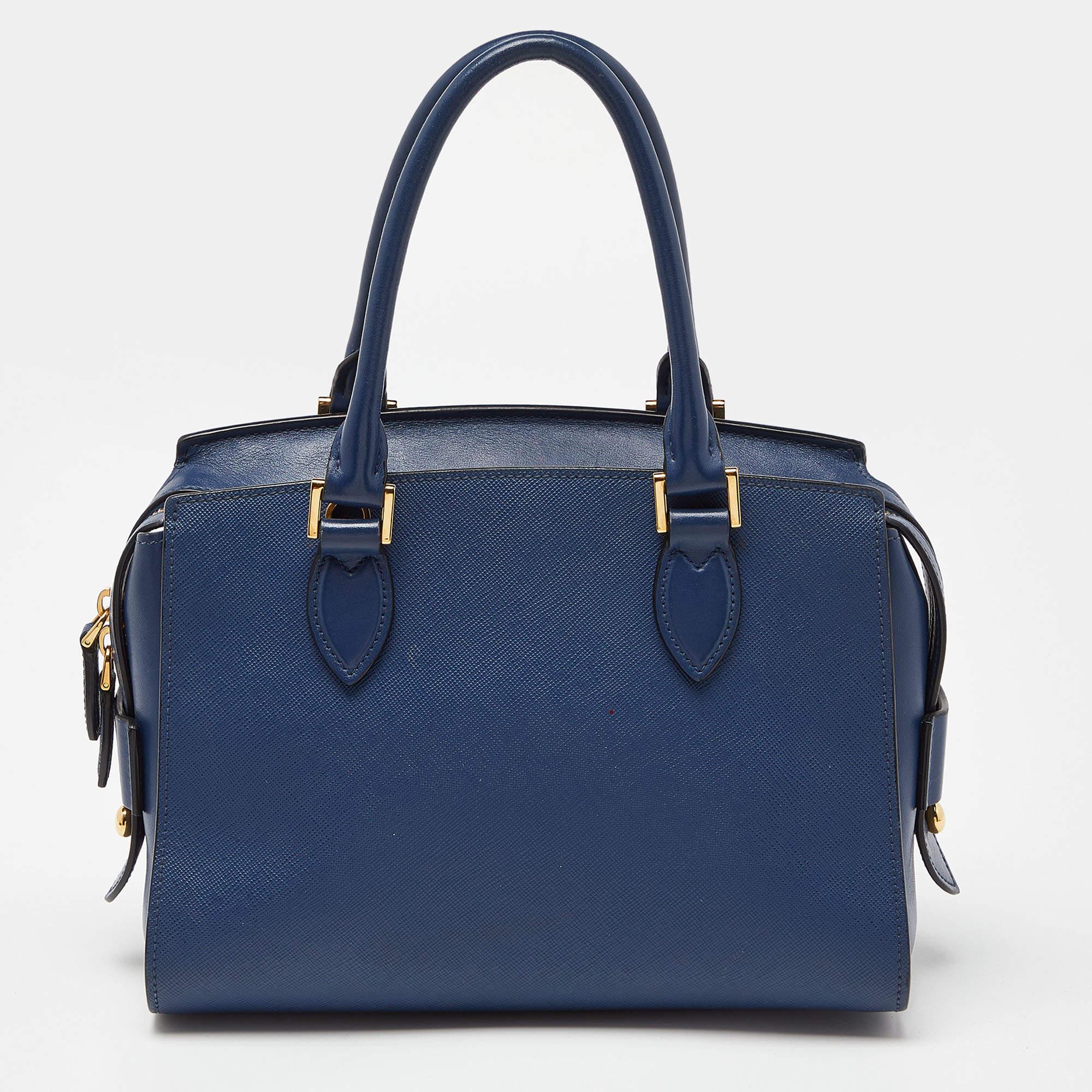 Thoughtful details, high quality, and everyday convenience mark this designer bag for women by Prada. The bag is sewn with skill to deliver a refined look and an impeccable finish.

Includes: Authenticity Card, Info Card, Info Booklet, Detachable