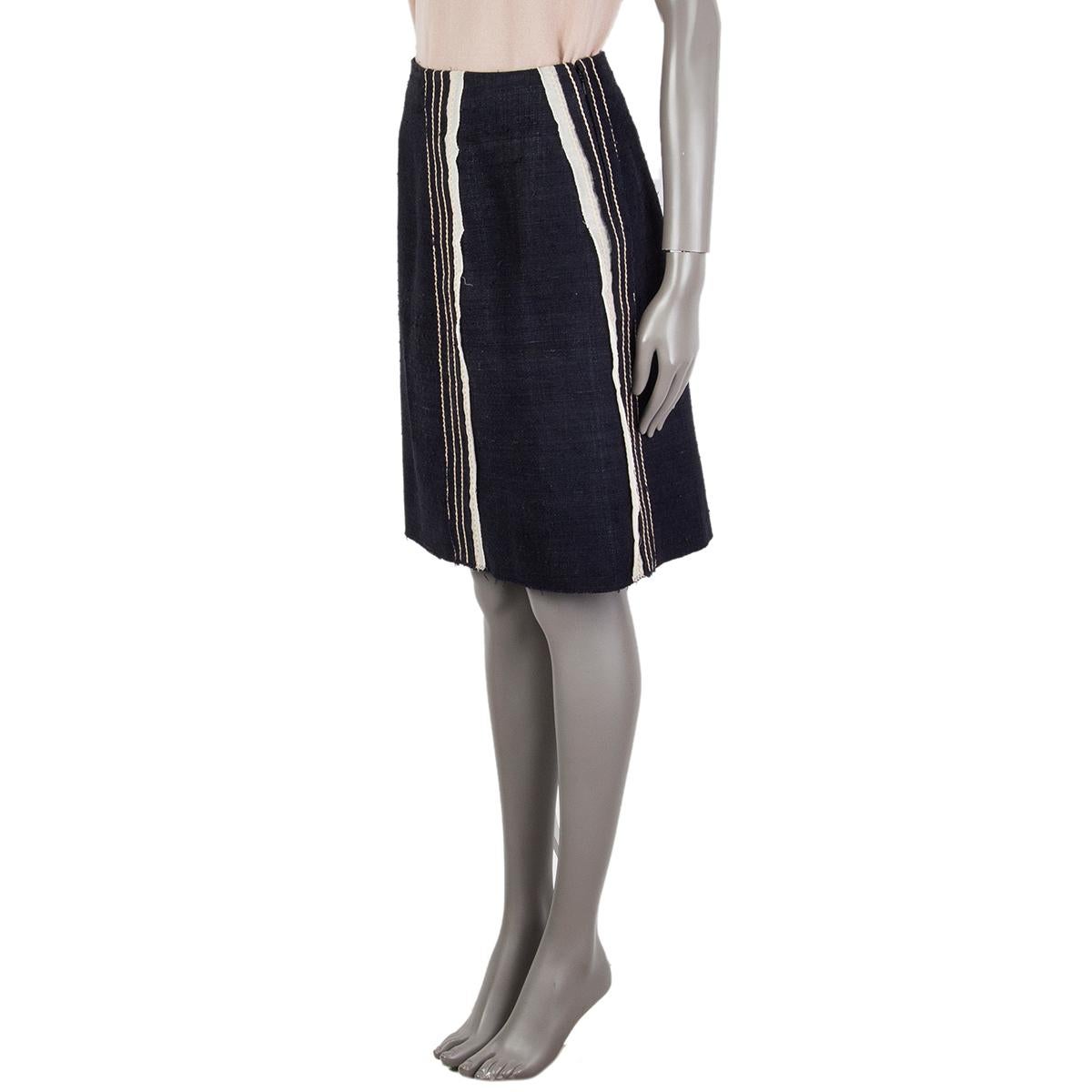 Prada panelled tweed skirt in midnight blue and off-white silk (100%), inserts are cotton (100%) and other trims are cotton (78%), nylon (17%) and elastane (5%). Closes on the back with a concealed zipper. Lined in cupro (60%) and silk (100%). Has