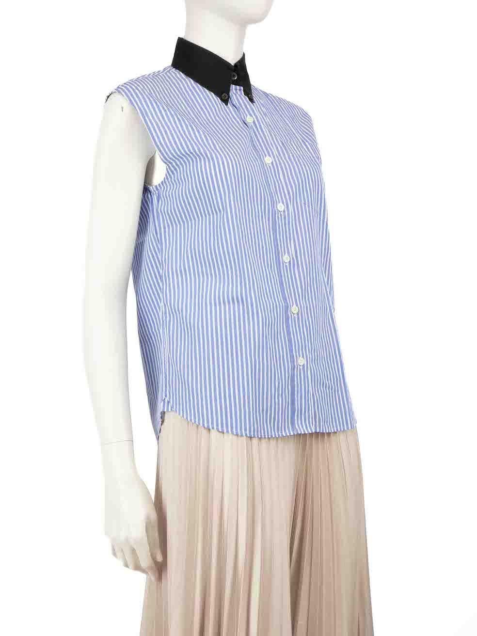 CONDITION is Very good. Minimal wear to the shirt is evident. Minimal discolouration to the collar on this used Prada designer resale item.
 
 
 
 Details
 
 
 Blue
 
 Cotton
 
 Sleeveless shirt
 
 Striped pattern
 
 Black collar
 
 1x Front pocket
