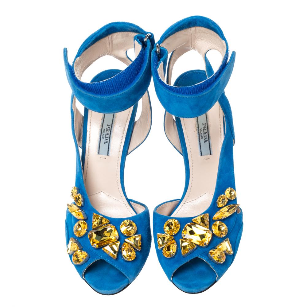 These exquisite sandals by Prada will elevate your show collection instantly. Crafetd from quality suede, they come in a lovely shade of blue. They are styled with peep-toes, crystal embellished uppers, ankle cuffs with velcro closure, gold &