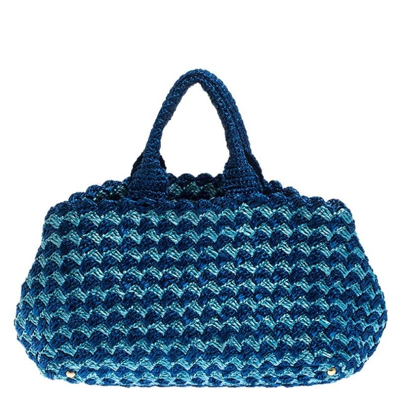 Fashioned with raffia, this fun piece in blue and turquoise is a splendid purchase. The interior lined with nylon exhibits ample space for your needs. An essential wardrobe accessory, this Prada tote is surely a must-have

Includes: Original