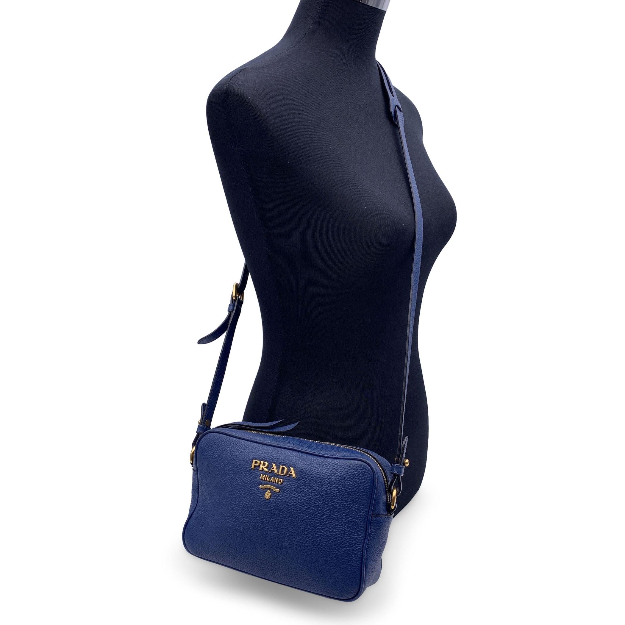 This beautiful Bag will come with a Certificate of Authenticity provided by Entrupy. The certificate will be provided at no further cost. PRADA blue Vitello Phenix leather crossbody bag, mod. 18H079. Gold metal Prada lettering on the front. Zip