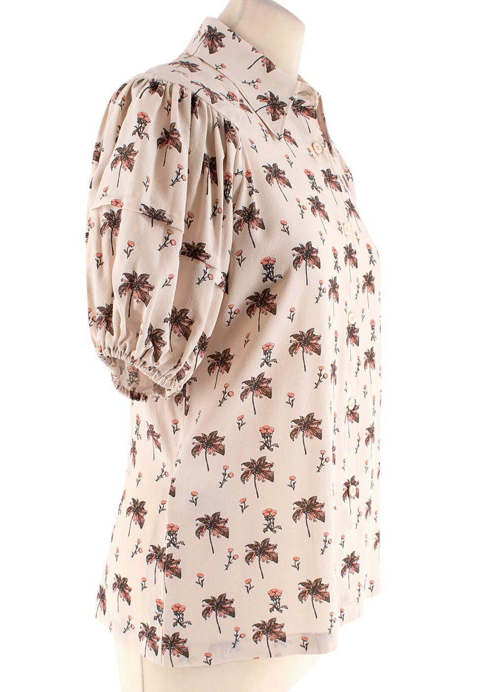Prada Nude Silk Printed Puffed Sleeve Buttoned Blouse

- Soft silk design 
- Nude floral print 
- Gentle puff sleeves
- Pointed collar
- Front buttoned fastening

Materials: 
100% Silk

Dry Clean Only 

Made in China 

Shoulders - 37cm
Sleeves -