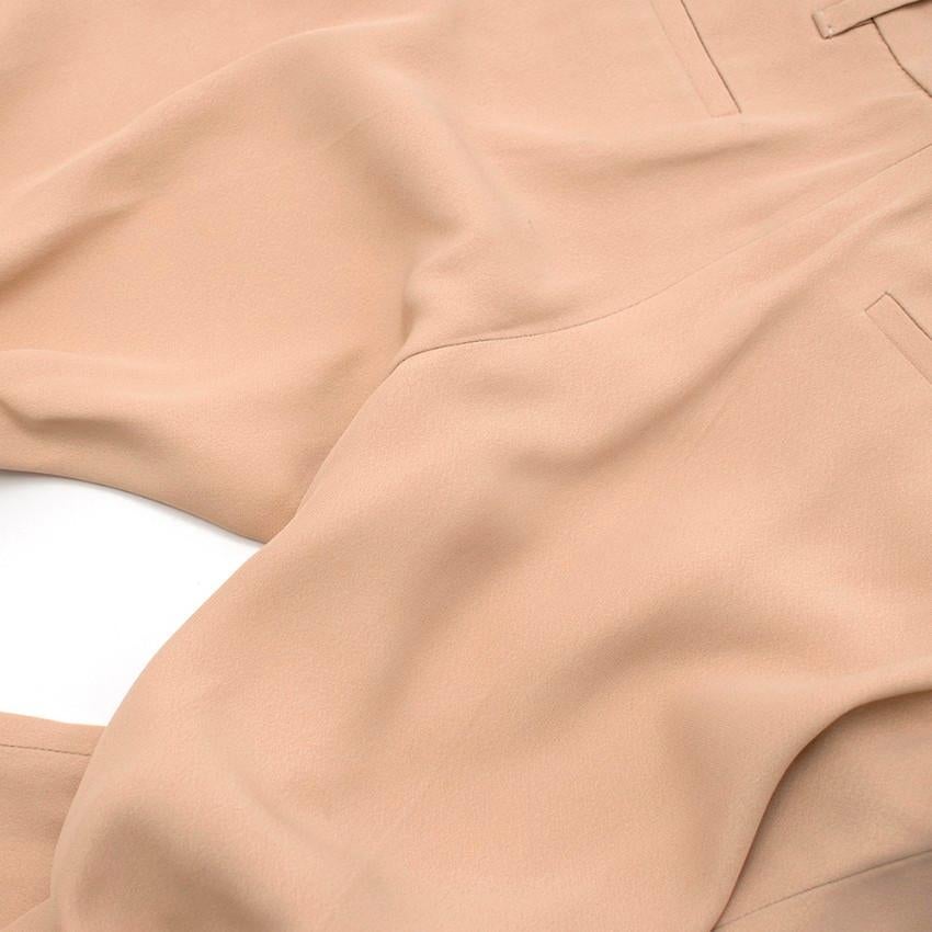 Prada blush pink trousers intended for a casual fit featuring a turn up on at the bottom.

Please note, these items are pre-owned and may show signs of being stored even when unworn and unused. This is reflected within the significantly reduced