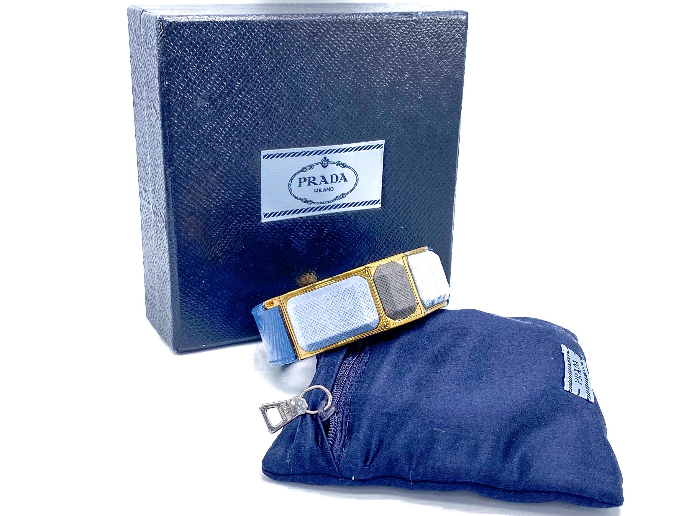 Prada Vintage Blue Leather Cuff Bracelet 

Fantastic statement leather bracelet from the House of Prada Spring 2014 collection

Detail
-Made in Italy from saffiano leather
-High shine gold coloured hardware
-Push button hinged closure for easy on