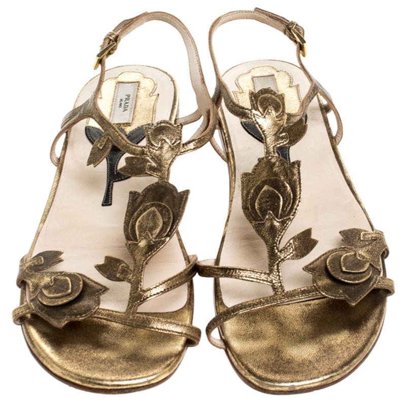 These leather sandals keep your feet feeling comfortable all day. Keep it light and simple with these leather sole sandals. The bronze pair by Prada features thin straps, tulip motifs, ankle fastening and tough soles.

