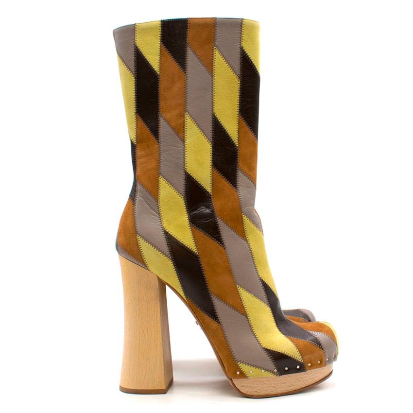 Prada Brown and Yellow Leather Platform Boots

-Brown/grey leather patches and camel/yellow suede patches
-Wooden block heel and wooden platform
-Grey zig zag stitching around patches
-Round toe
-Silver upholstery detail around edge of toe 
-Mid