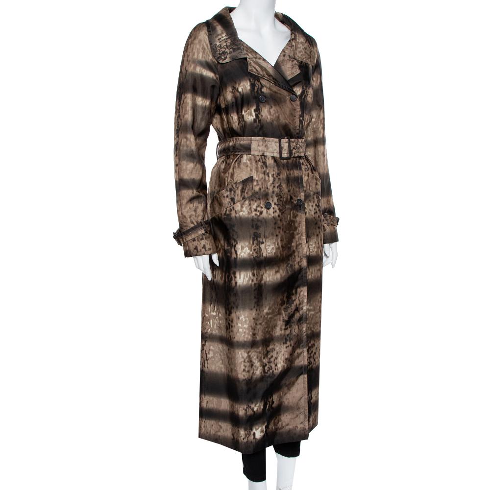 This Prada double-breasted, synthetic brown animal-printed trench coat is a chic, stylish cover-up with a collared neck, a detachable belt, two hip pockets, and front button closure. It is a lightweight creation offering a comfortable fit.

