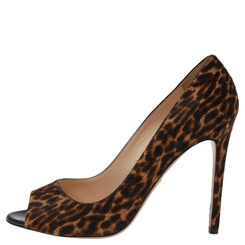 Recognized to craft luxury pieces, the House of Prada delivers yet another creation. These pumps are the epitome of everlasting fashion. Their exterior is made from brown-beige leopard printed calf hair material with a peep-toe cut and pointy 12 cm