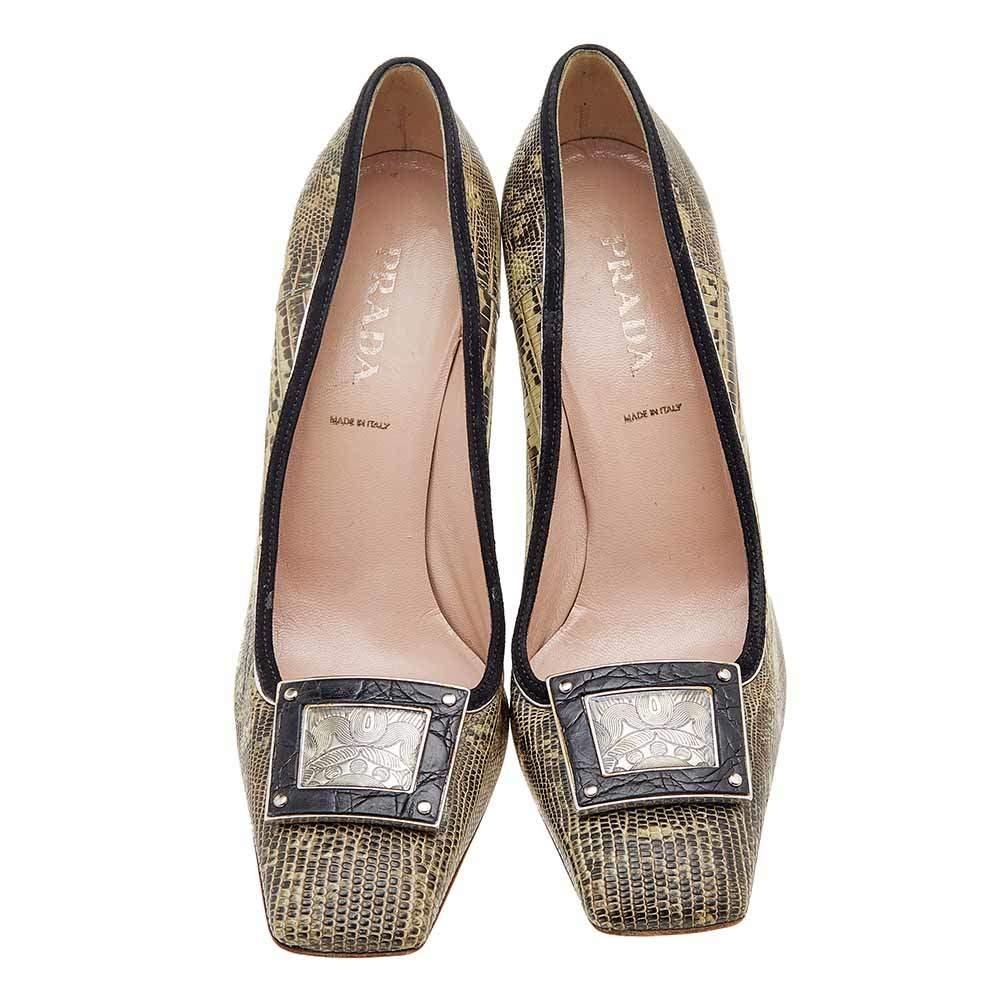 How classy are these pumps from the House of Prada! They are designed using brown-beige lizard leather and suede trims on the exterior. They showcase a silver-tone embellishment on the toes, 10 cm heels, and an easy slip-on feature. Look classy as