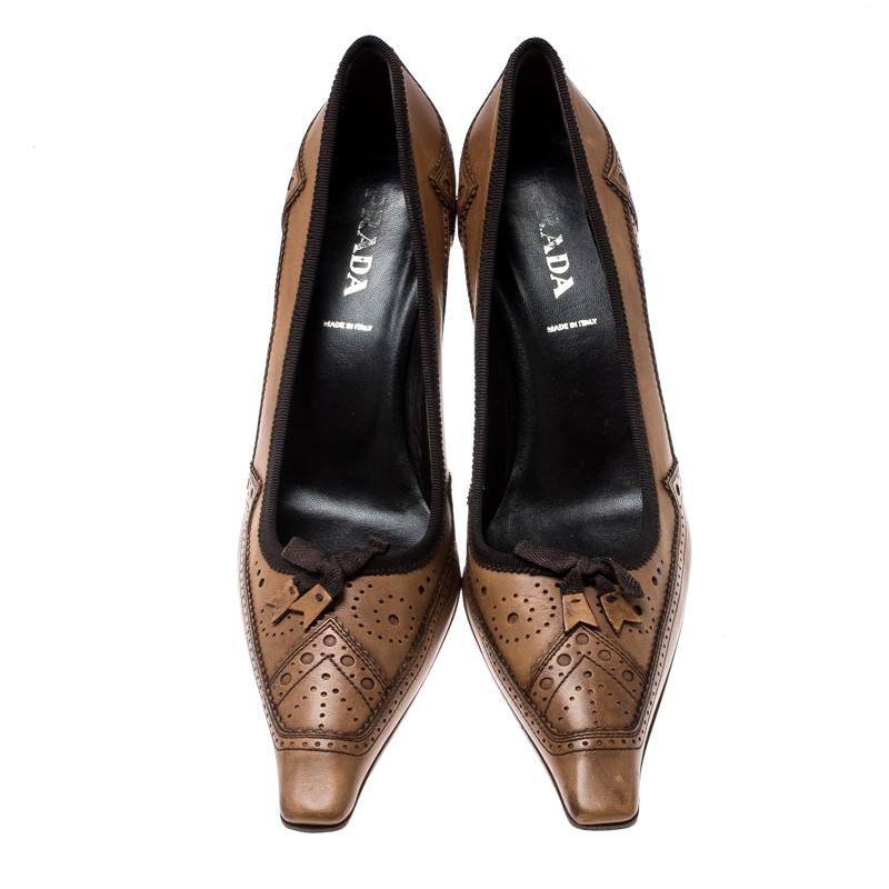 Showcase the latest trends in fashion when you wear this pair of brogue leather pumps. With this one, Prada has brought yet another comfortable pair. In a world of basics, this pair of brown pointed-toe pumps sets your style apart.

