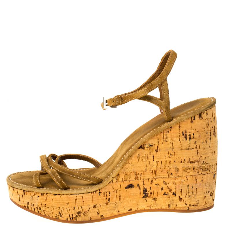 Wear these suede wedge sandals when you go out and watch heads turn. With criss cross straps, ankle fastenings and cork heels, these are crafted to offer you the maximum comfort. These from the house of Prada are a fine blend of comfort and style.

