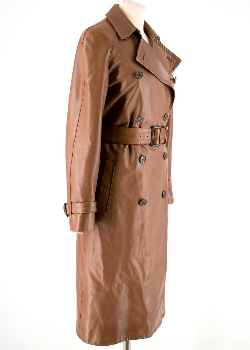 Prada trench coat tailored in Italy from brown leather and it's cut in a slim, double-breasted silhouette. Features a belt to cinch the waist, angled pockets and belted cuffs.

- Long sleeves 
- Button fastenings through double-breasted front
- Two