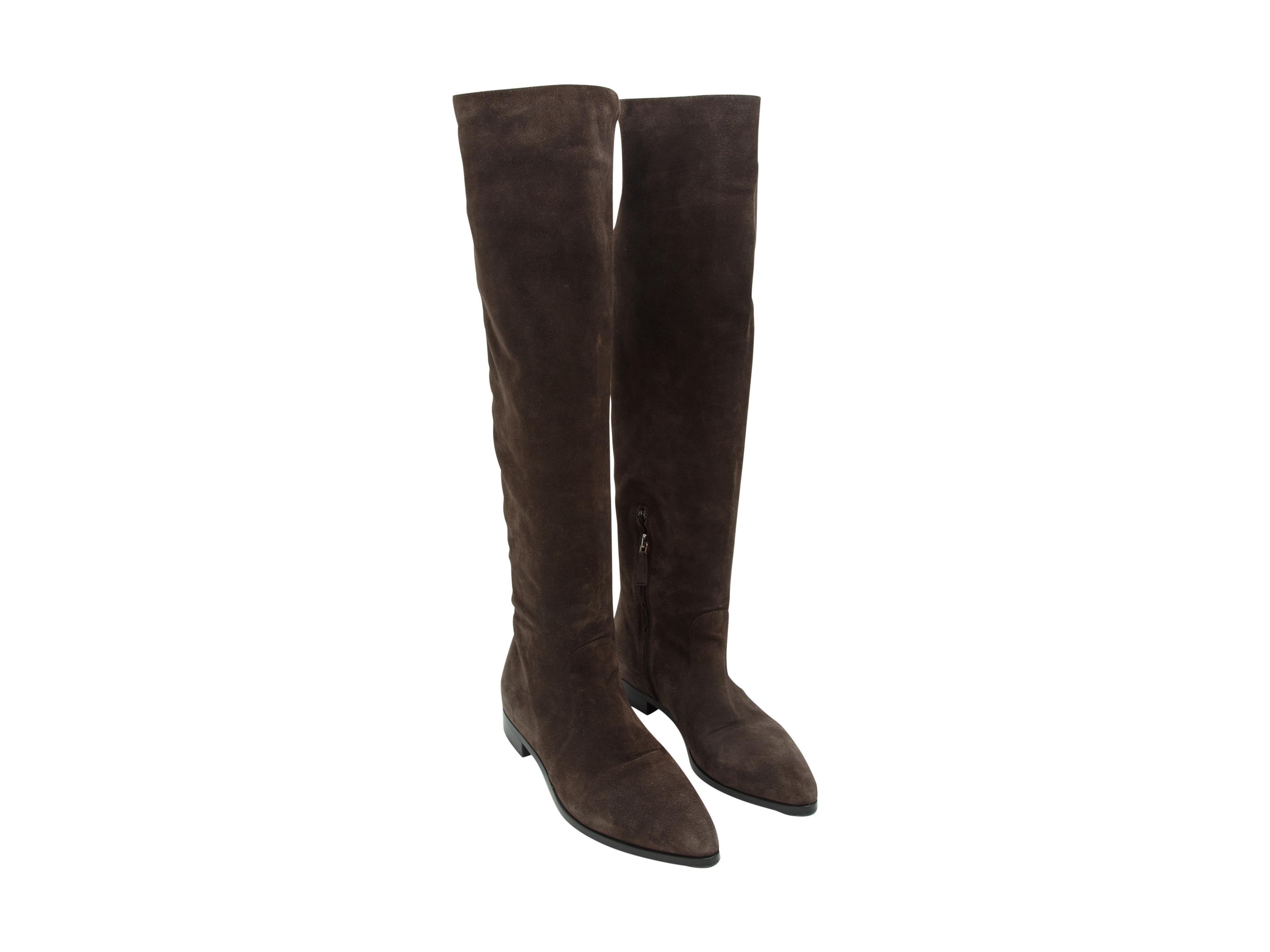 Product details:  Brown knee-high flat suede boots by Prada.  Inner quarter zip closure.  Point toe.  
Condition: Pre-owned. Very good. 
Est. Retail $ 1,100.00