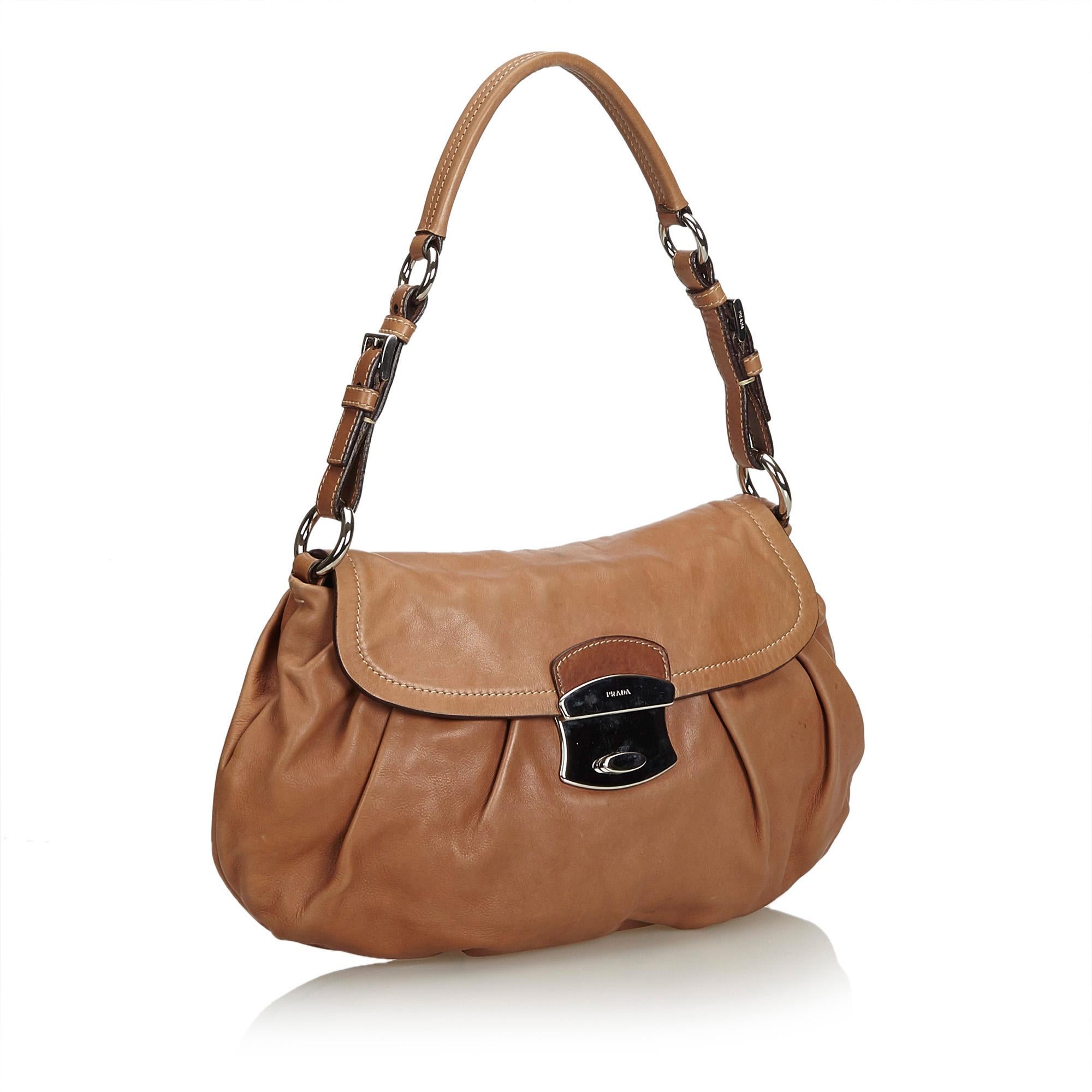This baguette features a leather body, a flat adjustable leather strap, a front flap with a metal lock closure, an open top wih a magnetic closure, and an interior zip pocket. It carries as B+ condition rating.

Inclusions: 
Dust Bag
Authenticity