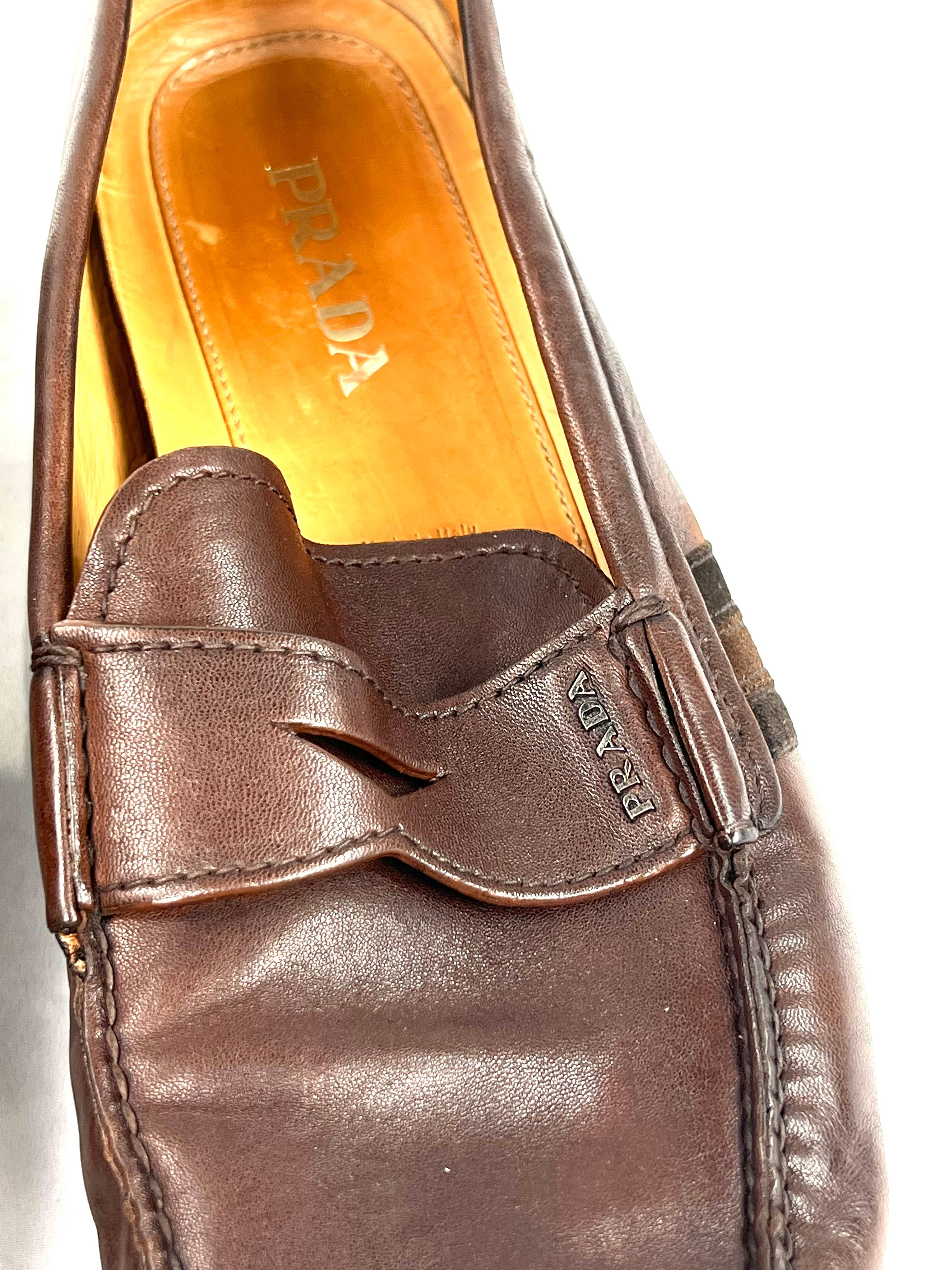 Product details:

The shoes are made out of brown leather. It features brown and black striped design and rubber soles.