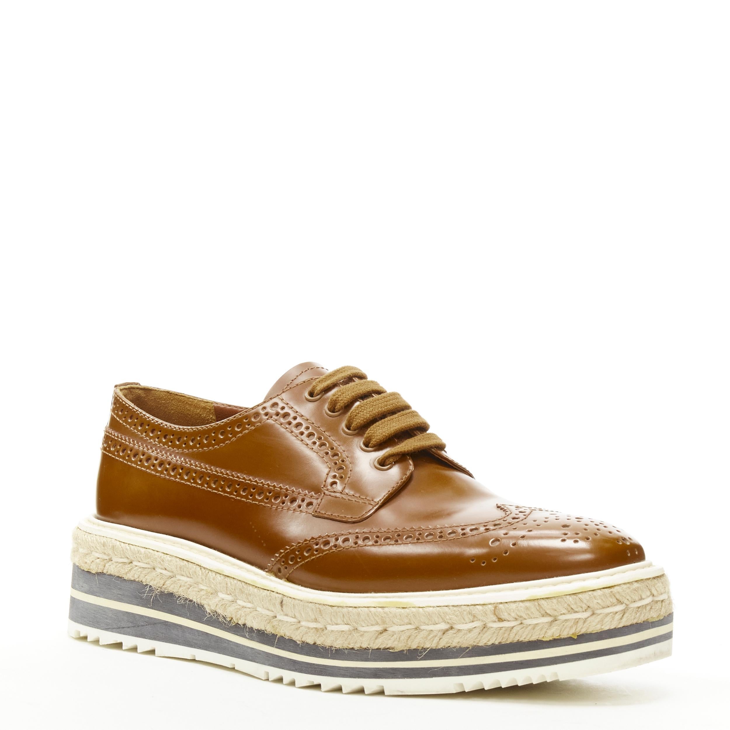 PRADA brown leather perforated striped espadrille jute platform brogue EU37.5 
Reference: AEMA/A00055 
Brand: Prada 
Designer: Miuccia Prada 
Model: Platform brogue 
Material: Leather 
Color: Brown 
Pattern: Solid 
Closure: Lace 
Extra Detail: Tan