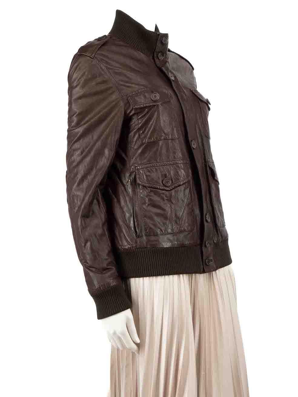 CONDITION is Very good. Minimal wear to jacket is evident. Minimal wear to the leather surface with light creasing seen throughout as well noticeable tarnishing of the hardware components on this used Prada designer resale item.
 
 Details
 Brown
