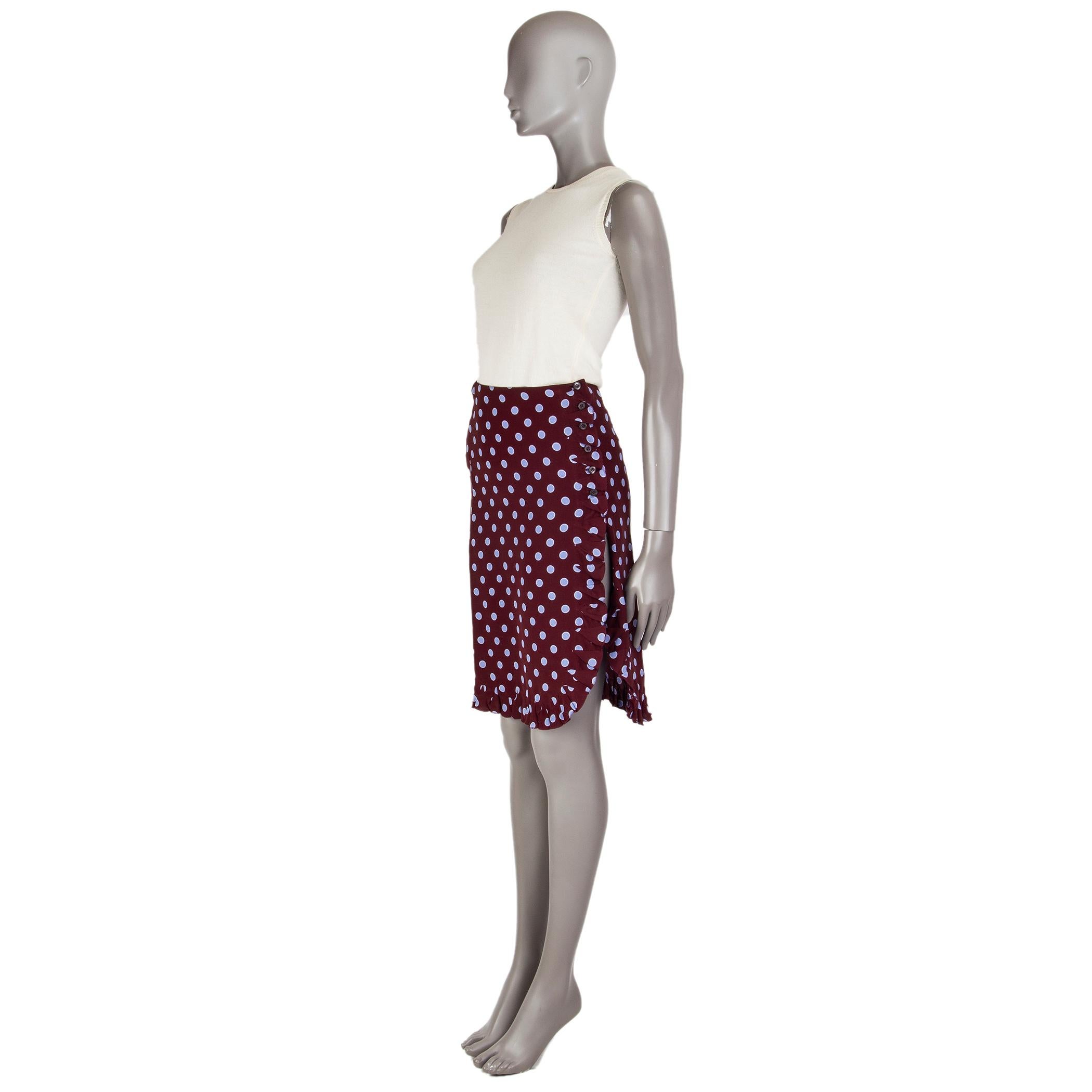 Prada polka dot skirt in brown and violet silk (100%) with a slit in the front and a ruffled hemline. Closes with buttons along the hemline in the front. Unlined. Has been worn and is in excellent condition.

Tag Size 38
Size XS
Waist 34cm