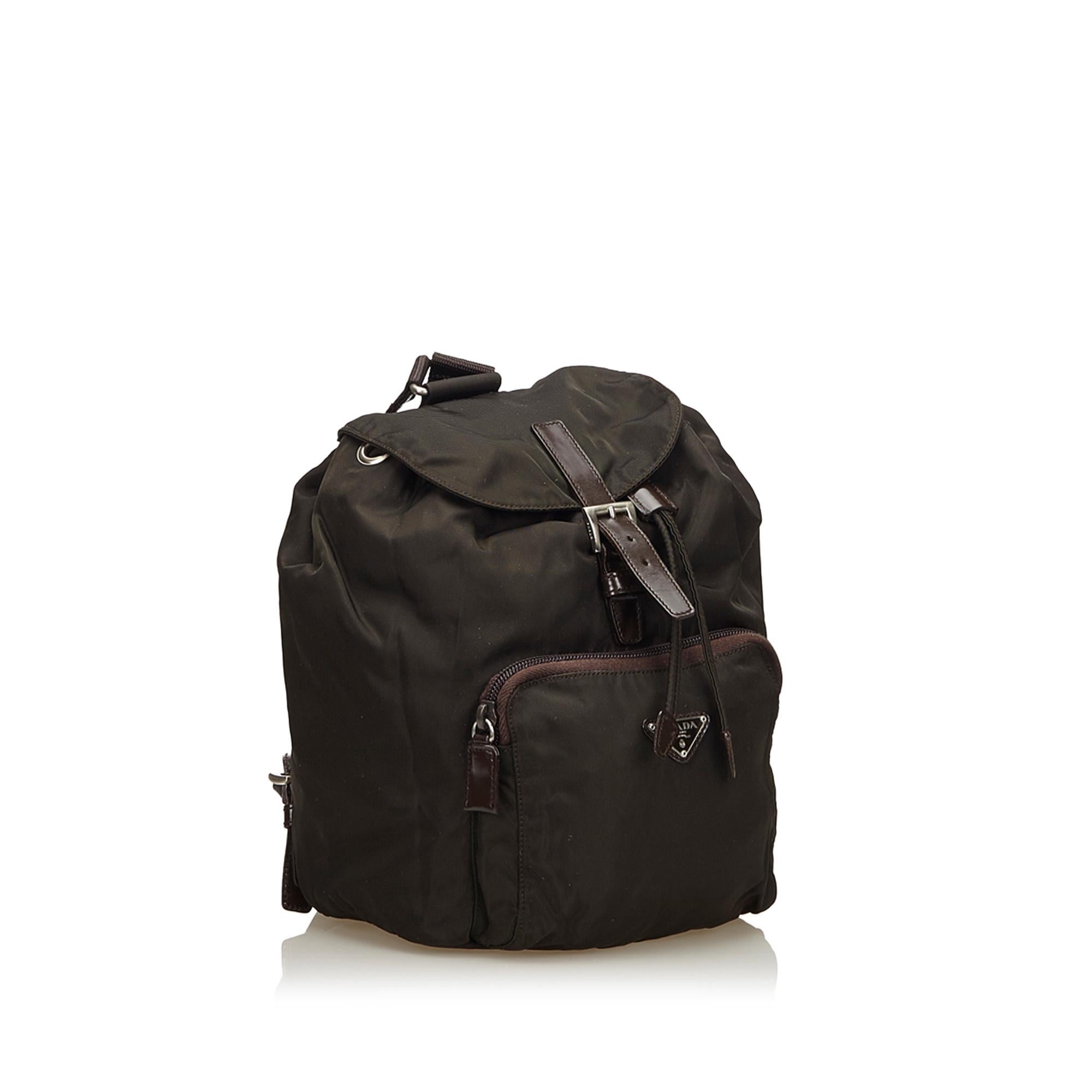 This backpack features a nylon body, flat back straps, top flap with buckle closure, drawstring closure, and an exterior zip pocket. It carries as B+ condition rating.

Inclusions: 
Authenticity Card

Dimensions:
Length: 24.00 cm
Width: 19.00
