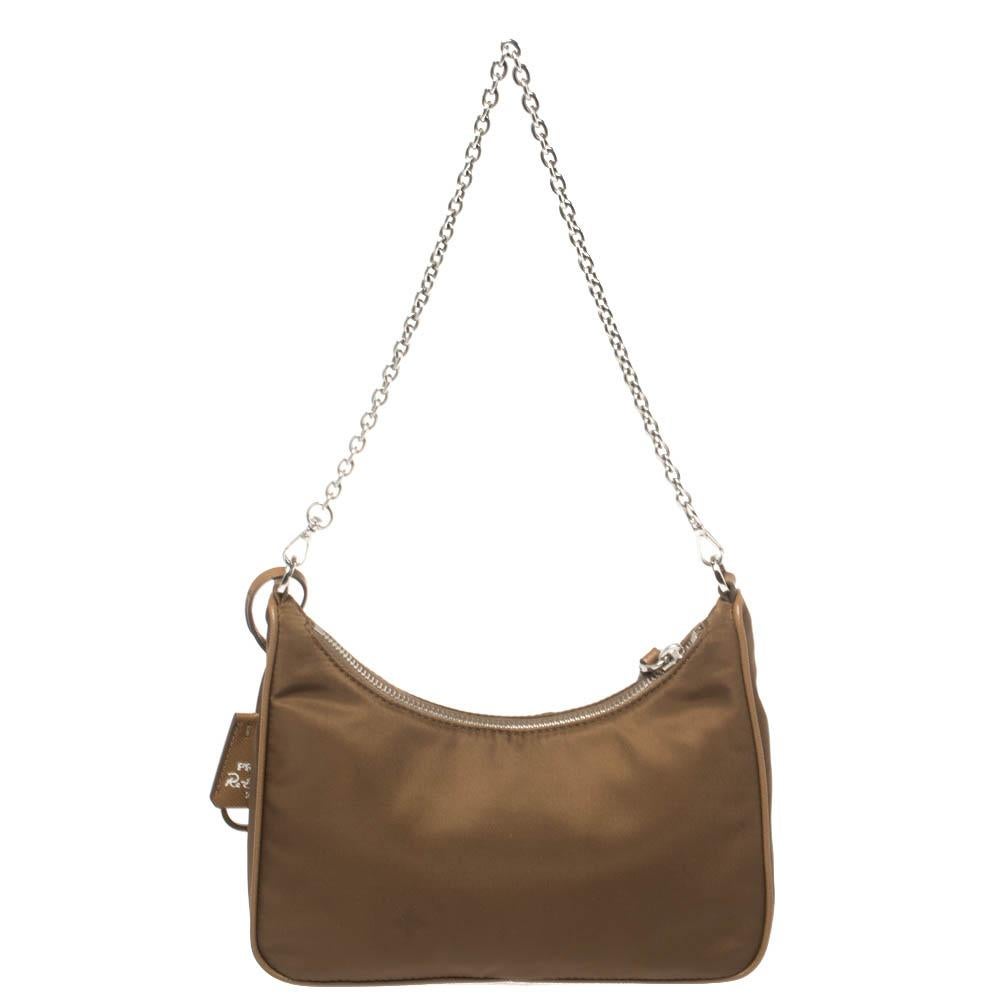 The bag that has caught the instant fancy of celebrities, bloggers, and every one fashionable, Re-Edition 2005 from Prada is one of the IT bags of the season. Designed in a petite silhouette from nylon, the bag is adorned in a brown hue and features
