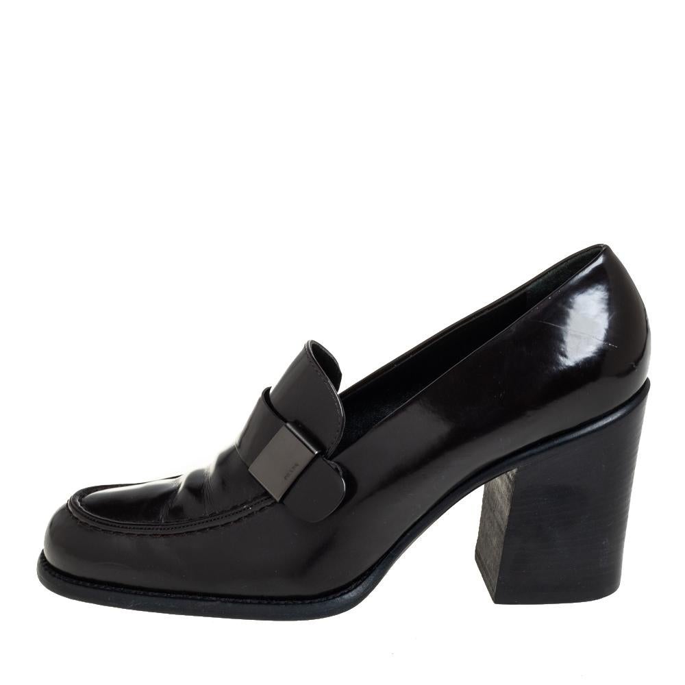 Work your magic while donning this pair of pumps from Prada. Featuring a unique design, they are crafted from patent leather and feature comfortable leather-lined insoles and low block heels.