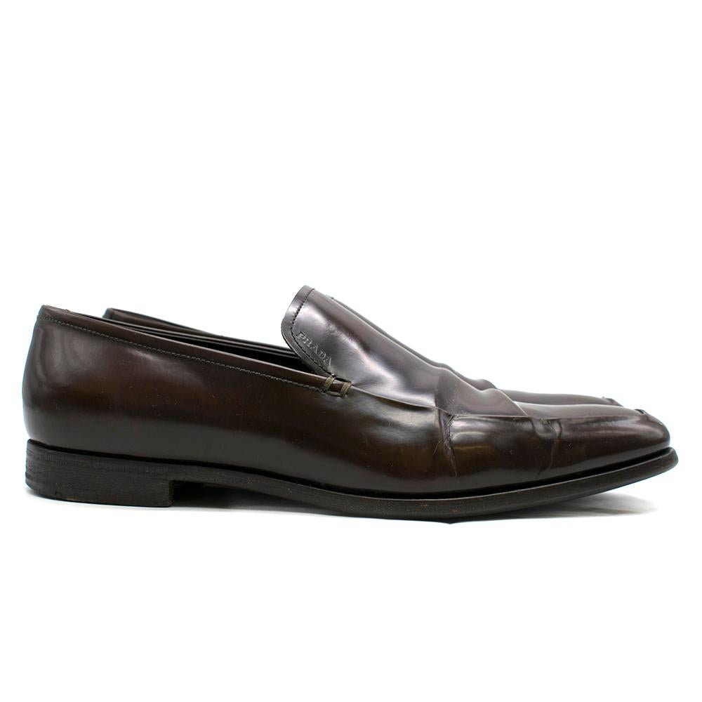 Prada Brown Patent Leather Moccasin Loafers

- Square toe
- Logos on the upper parts
- Padded leather insole soothingly
- The heel is made with 4 pieces of leather lifts reinforced with rubber for balance and stride.
 
Please note, these items are