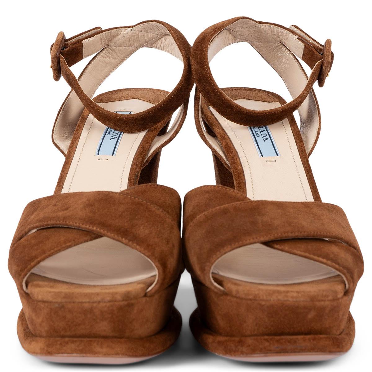 100% authentic  Prada ankle-strap platform sandals in cognac brown suede. Have been worn once inside and are in virtually new condition. 

Measurements
Imprinted Size	40
Shoe Size	40
Inside Sole	26cm (10.1in)
Width	8cm (3.1in)
Heel	11cm