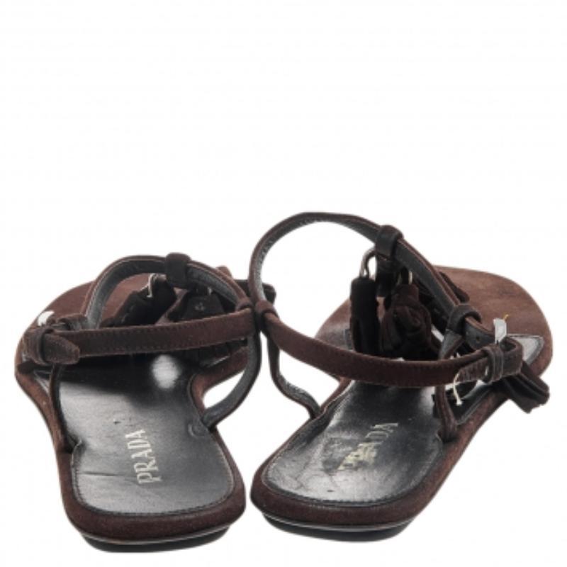 Opt for a relaxed day out in these sandals from Prada. They've been designed with style in mind and created from leather to provide comfort to your feet. Brown in shade, the sandals have a thong design with buckle fastenings and leather-lined