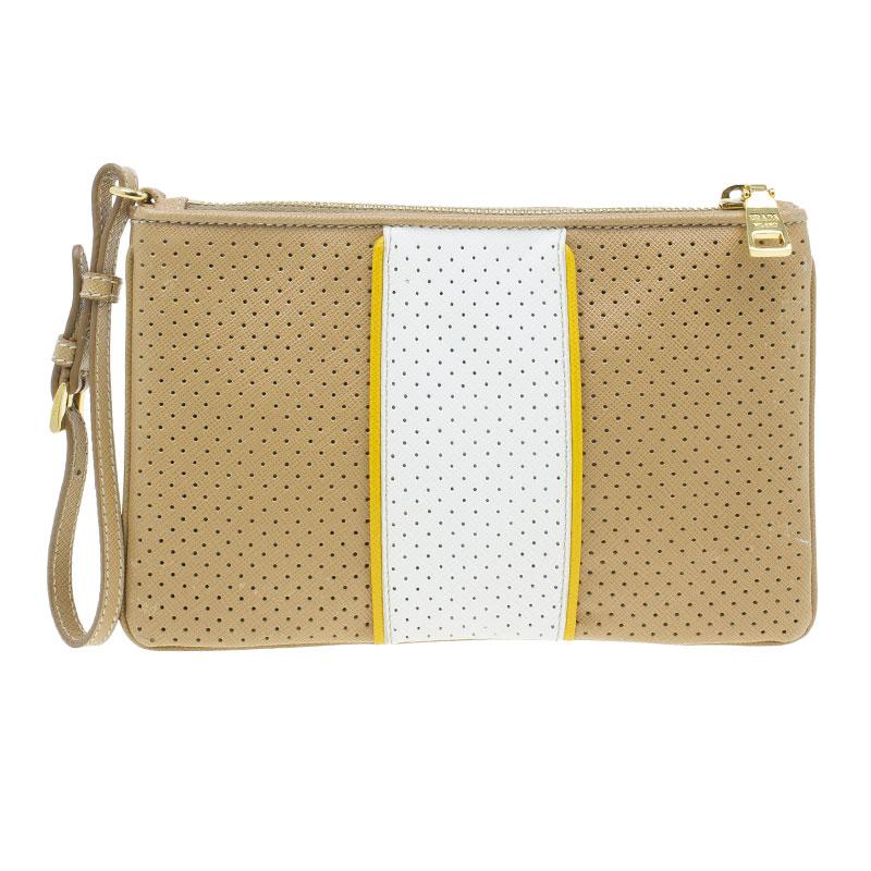 Be stylish with this gorgeous Prada wristlet clutch. It has been crafted with perforated Saffiano leather in brown and white. The contrasting yellow trimmed white panel features a brand name plaque at the front. The zip closure opens to a nylon