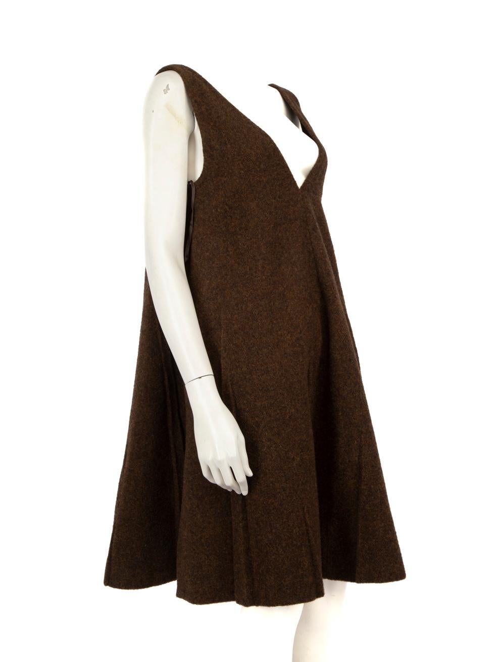 CONDITION is Very Good. Hardly any visible wear to the dress is evident on this used Prada designer resale item.
 
 Details
 
 
 Brown
 
 Wool
 
 Dress
 
 Knee length
 
 V neck
 
 Oversized
 
 Pleated detail
 
 A line
 
 
 
 
 
 Made in Italy
 
 
 

