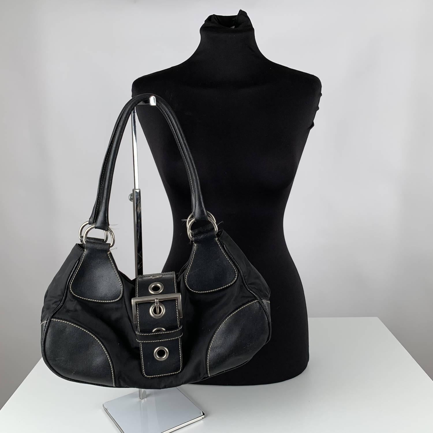 MATERIAL: Canvas COLOR: Black MODEL: Hobo GENDER: Women SIZE: Medium Condition CONDITION DETAILS: B :GOOD CONDITION - Some light wear of use - some scratches on leather trim due to normal use (especially on bottom corners) Measurements MEASUREMENTS:
