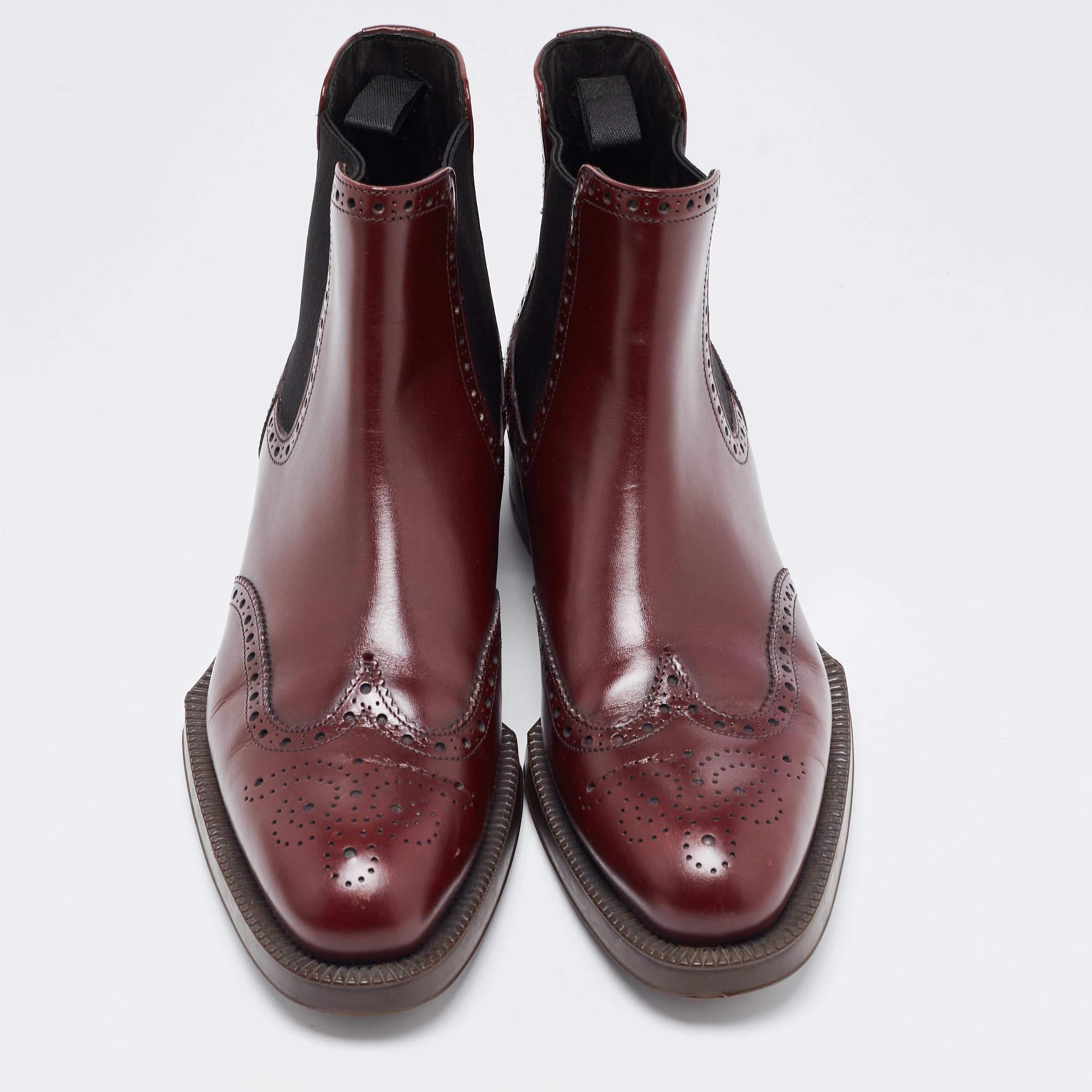 Elevate your style with these Prada burgundy boots for women. Crafted with precision, these leather ankle boots seamlessly blend fashion and comfort, offering sophistication for every season.

