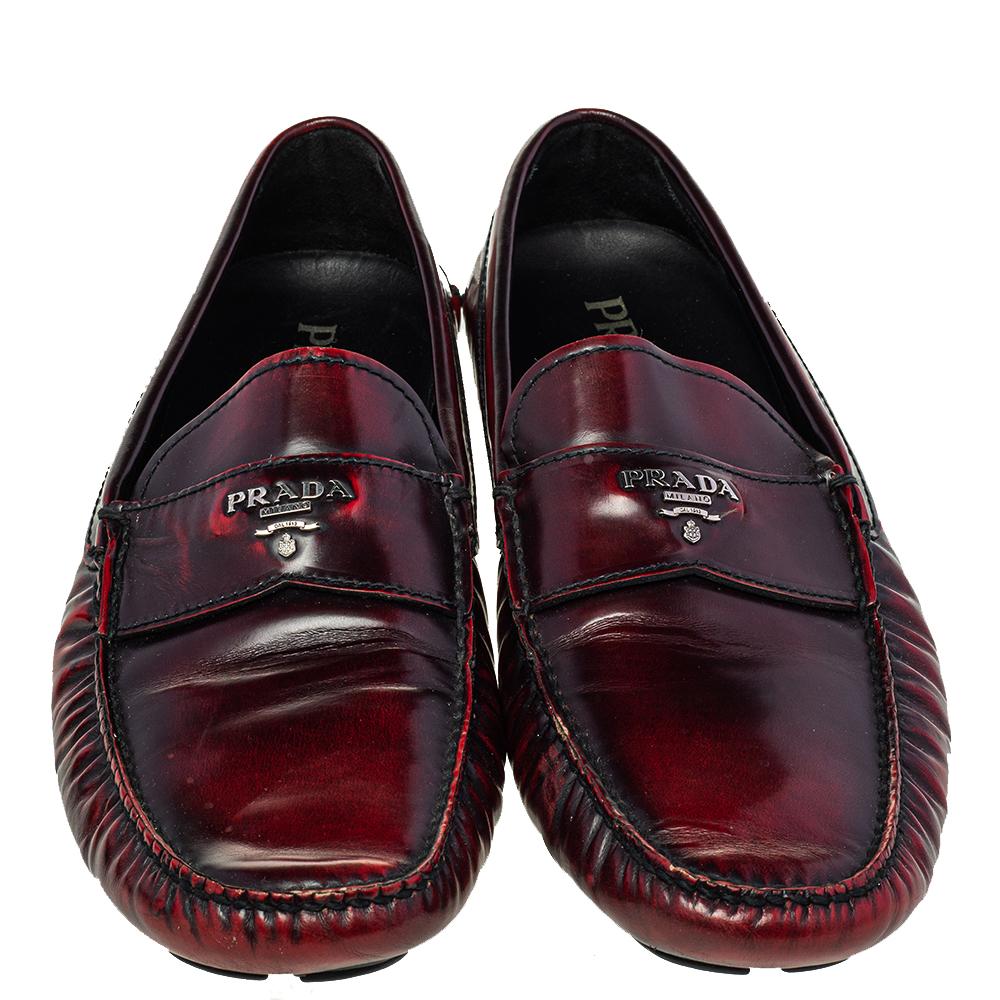 Stylish and super comfortable, this pair of loafers by Prada will make a great addition to your shoe collection. They have been crafted from quality leather and styled with logo detailing in silver-tone on the vamps. Leather insoles and rubber