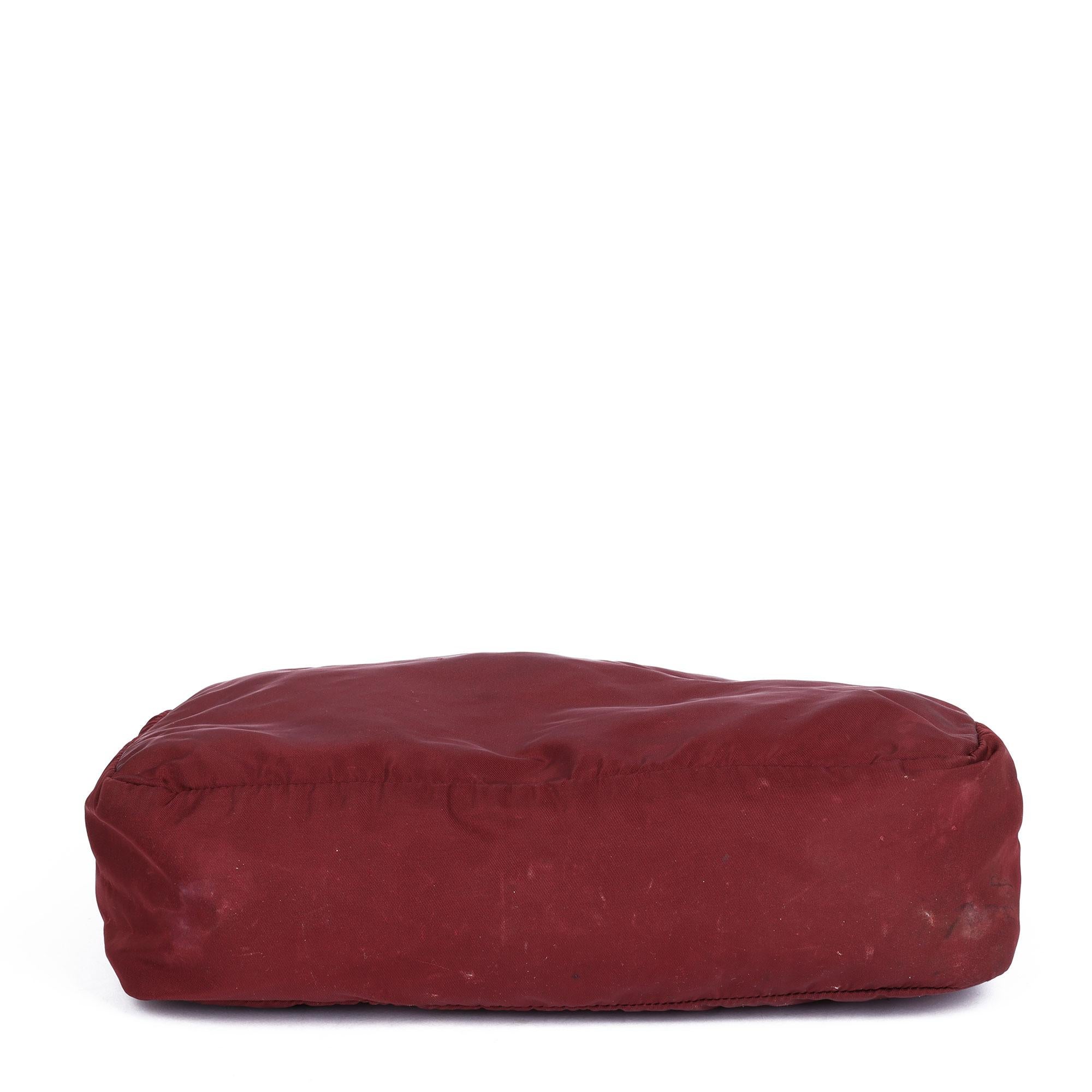 PRADA
Burgundy Nylon Vintage Toiletry Pouch

Xupes Reference: CWAHF-HB019
Serial Number: 104
Age (Circa): 1990
Authenticity Details: Date Stamp (Made in Italy)
Gender: Unisex
Type: Accessory, Clutch, Travel

Colour: Burgundy
Hardware: