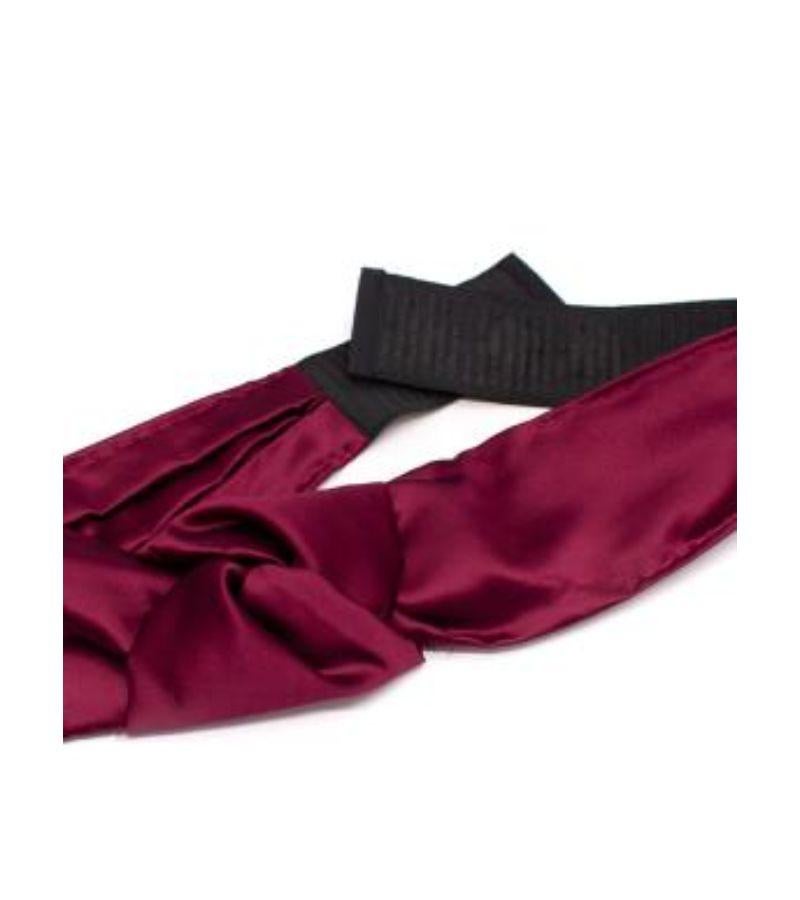 Prada Burgundy Silk Band Belt

- Exposed tonal stitching on the sides
- Elasticated black band with button closure
- Soft knot detail at the front

Materials:
100% Silk

Made in Italy

PLEASE NOTE, THESE ITEMS ARE PRE-OWNED AND MAY SHOW SIGNS OF