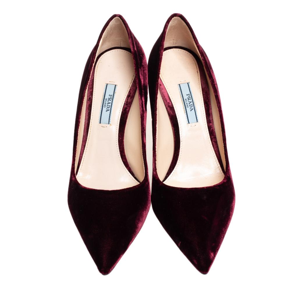 Raise the style bar wherever you go with this pair of Prada pumps. Made of velvet in burgundy and designed with pointed toes and 9 cm heels, these will give you the perfect amount of fashion and confidence.

