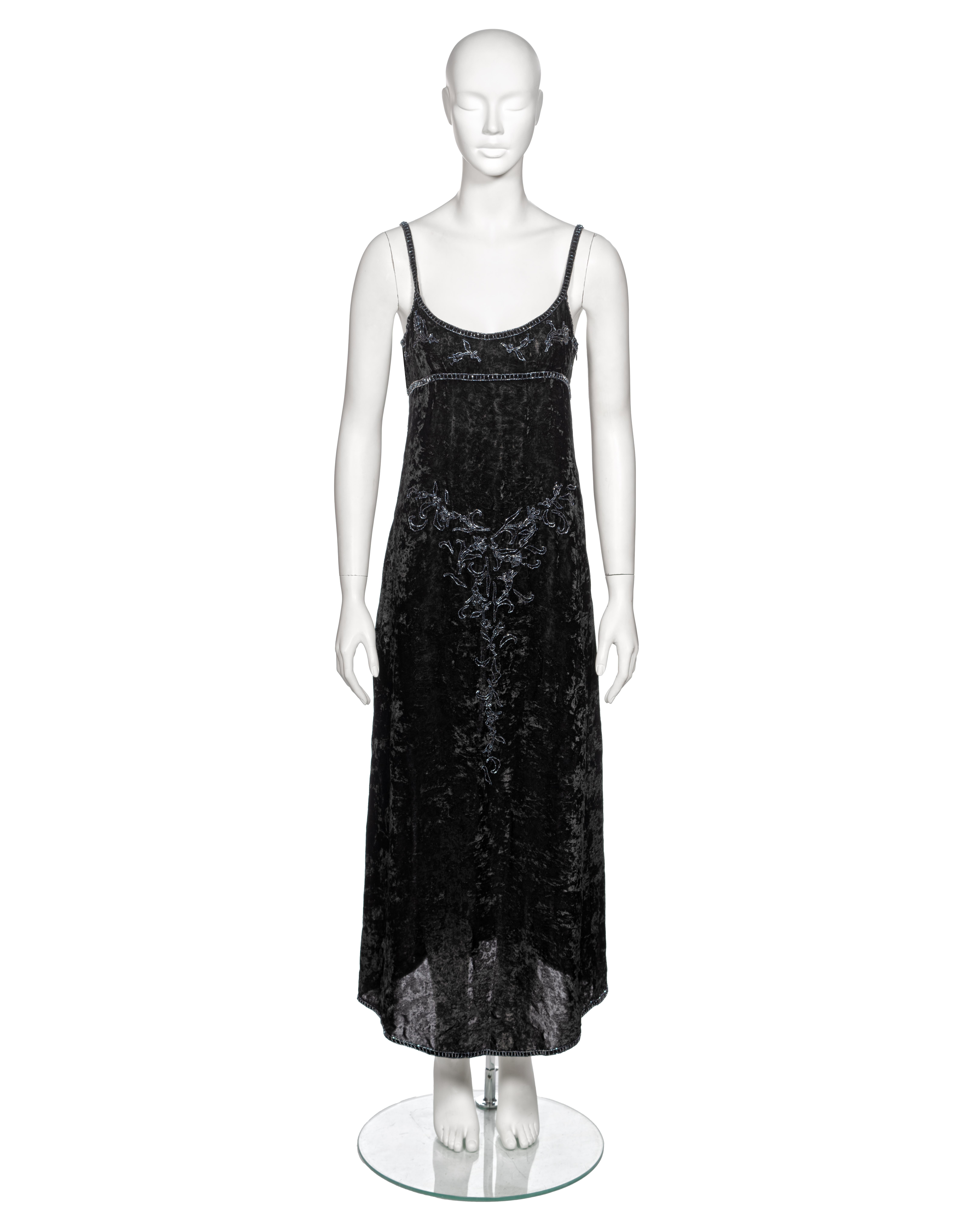 ▪ Archival Prada Velvet A-Line Slip Dress
▪ Creative Director: Miuccia Prada
▪ Fall-Winter 1997
▪ Sold by One of a Kind Archive
▪ Fashioned from a lightweight black crushed velvet
▪ Adorned with bugle bead embroidery depicting campanula flowers and