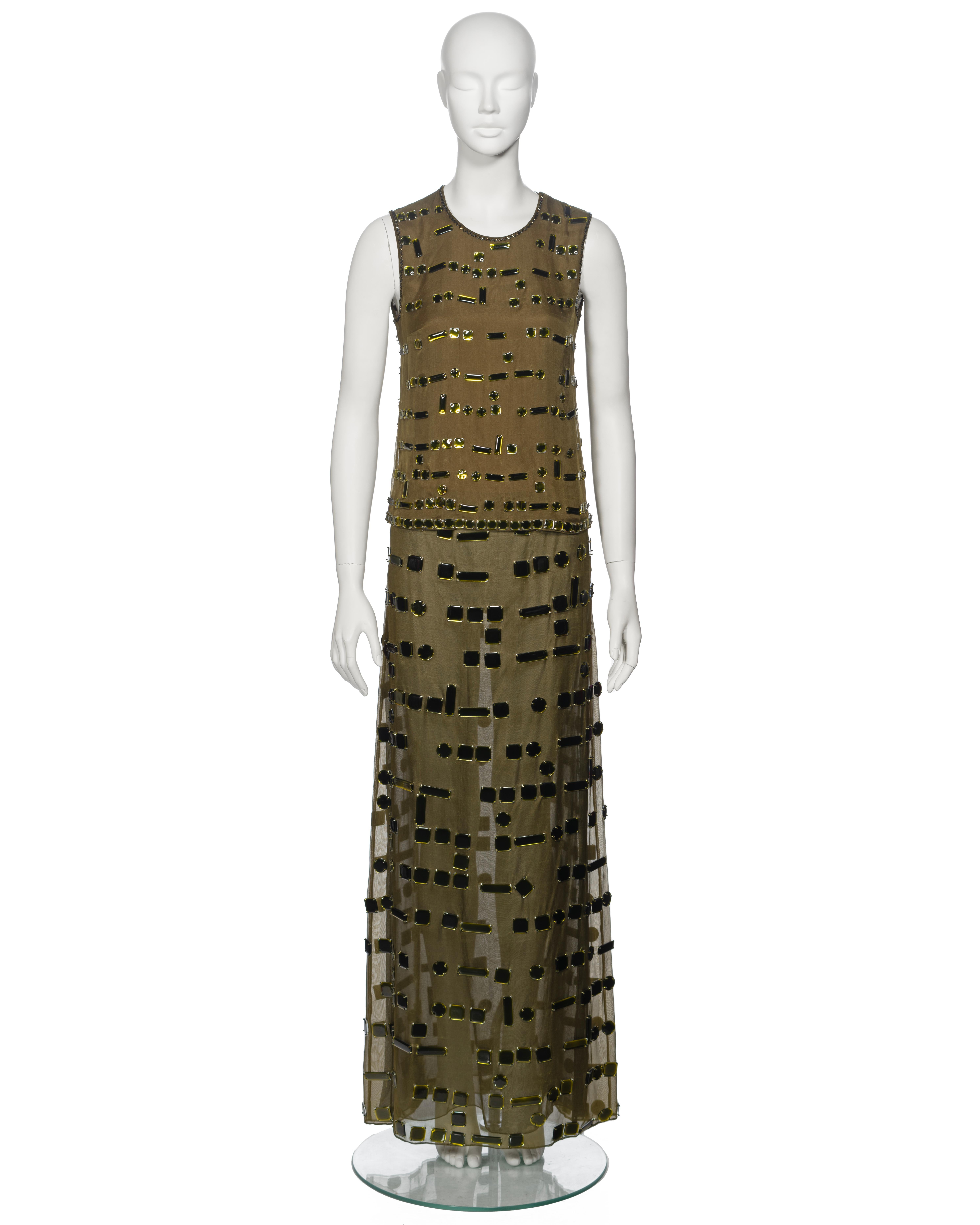▪ Archival Prada Embellished Evening Top and Skirt Set
▪ Creative Director: Miuccia Prada
▪ Fall-Winter 1999
▪ Sold by One of a Kind Archive
▪ Constructed from olive green silk organza 
▪ Lavishly embellished with a myriad of glass gems, cut in