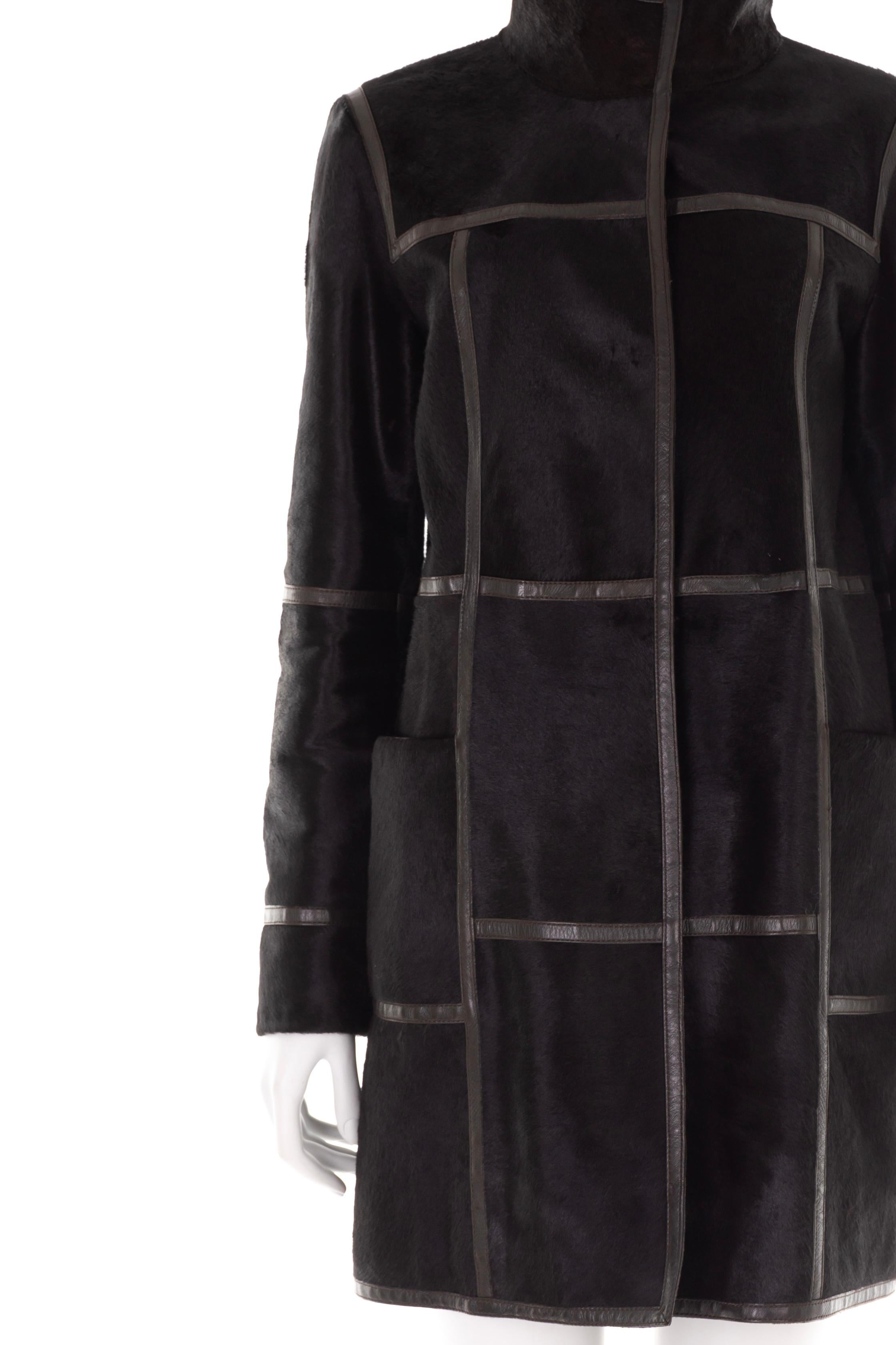 - Prada by Miuccia Prada
- Sold by Gold Palms Vintage
- Fall Winter 2005 collection
- Black calfskin hooded coat 
- Internal padding
- Long sleeve
- Double flat pockets
- Brown leather detailing
- Internal snap button fastening
- Size: IT