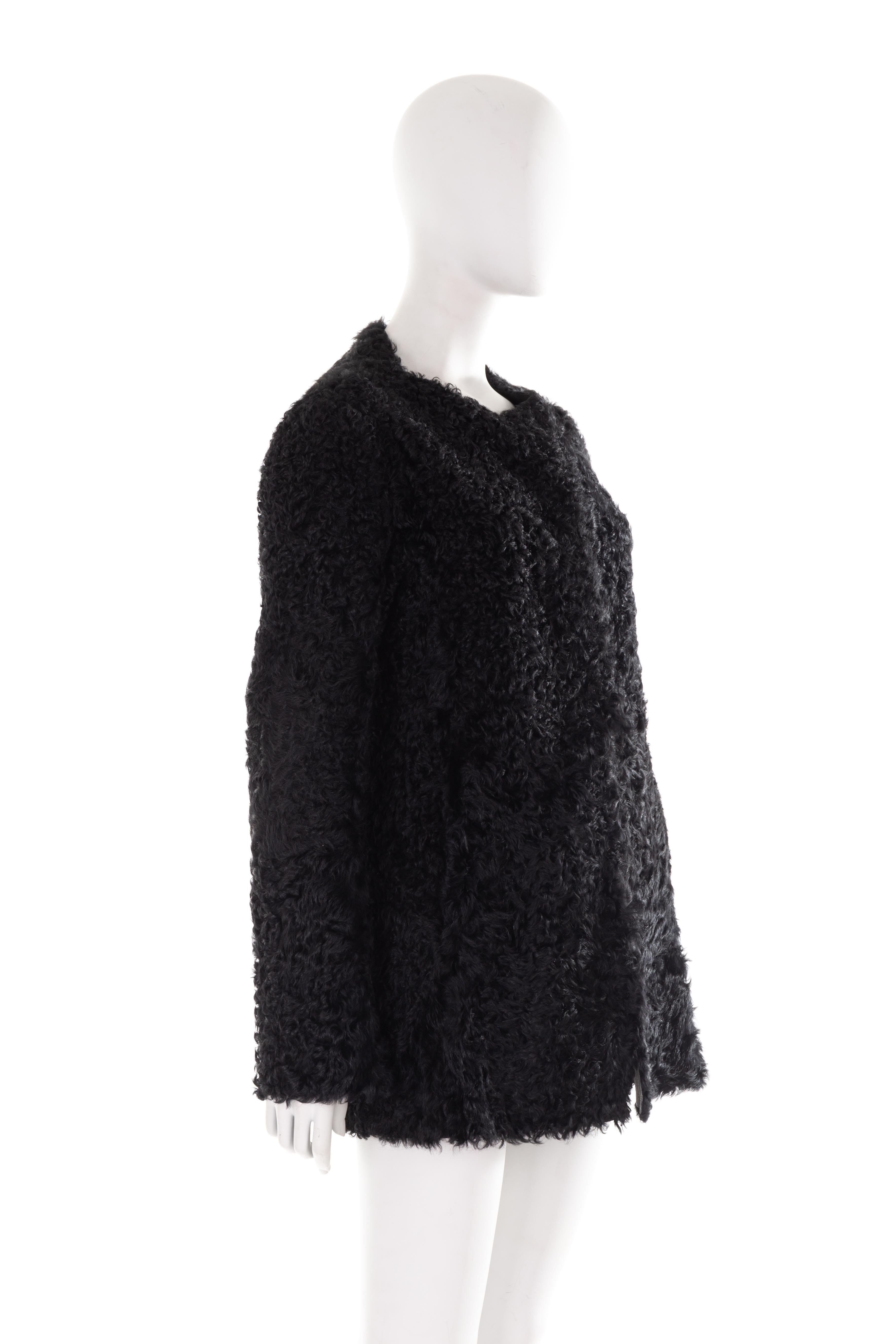 - Prada by Miuccia Prada
- Sold by Gold Palms Vintage
- Fall Winter 2011 collection
- Black curly Mongolian lamb fur coat
- Round neck
- Long sleeves
- Welt side pockets
- Black patent leather lining
- Size: IT 42

Shoulder to shoulder: 44 cm/ 17,3