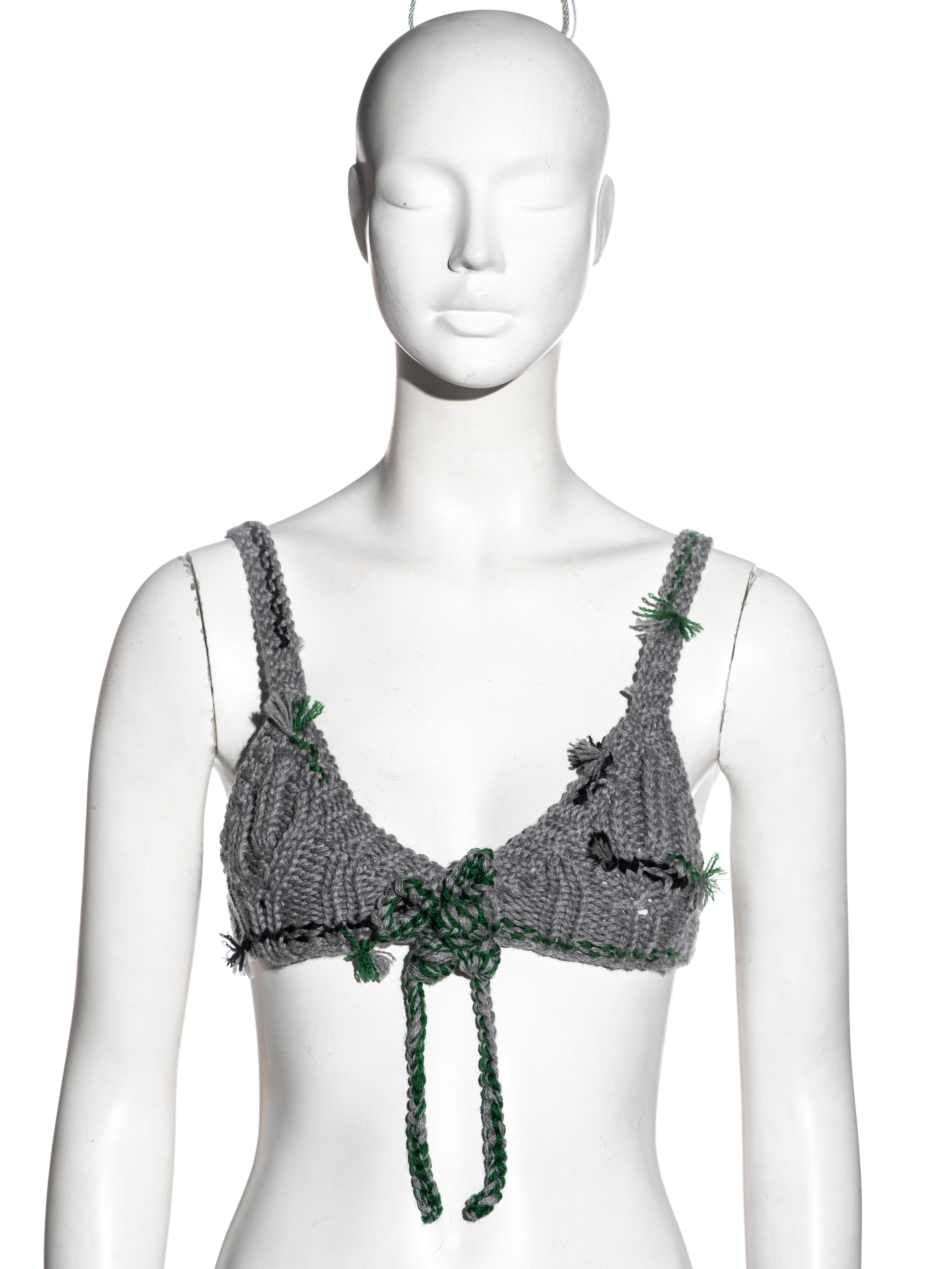 ▪ Prada knitted bra top
▪ Designed by Miuccia Prada
▪ Crocheted grey, green and black pure new wool 
▪ Bow detail at the centre-front 
▪ Snap-button closures at the centre-back
▪ IT 38 - FR 34 - UK 6 
▪ Fall-Winter 2017
▪ 100% Pure New Wool
▪ Made