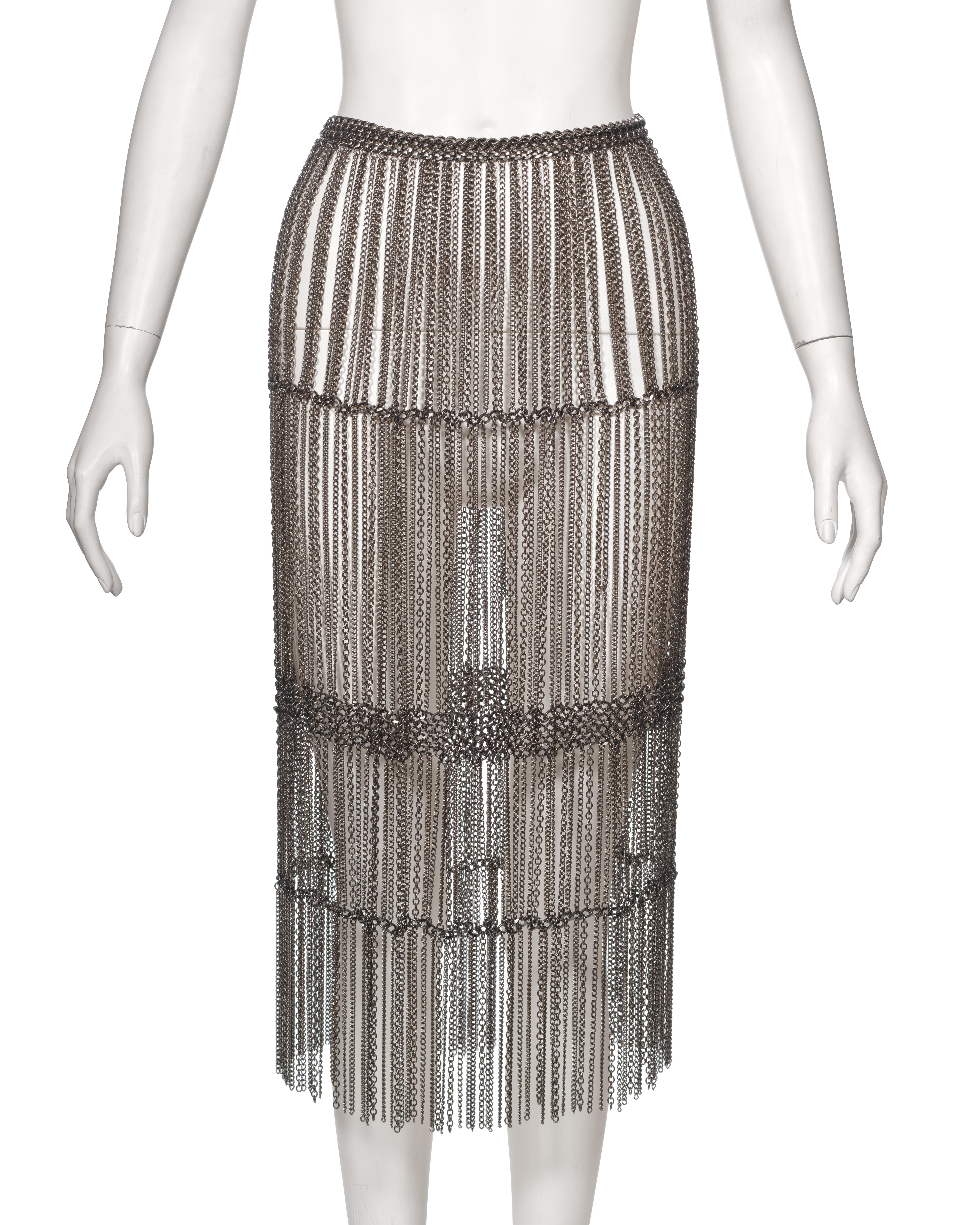 ▪ Archival Prada Metal Chain Fringed Skirt
▪ Creative Director: Miuccia Prada
▪ Fall-Winter 2002
▪ Sold by One of a Kind Archive
▪ Crafted from silver-tone metal chains
▪ Robust heavyweight construction
▪ High-waisted fit for a flattering