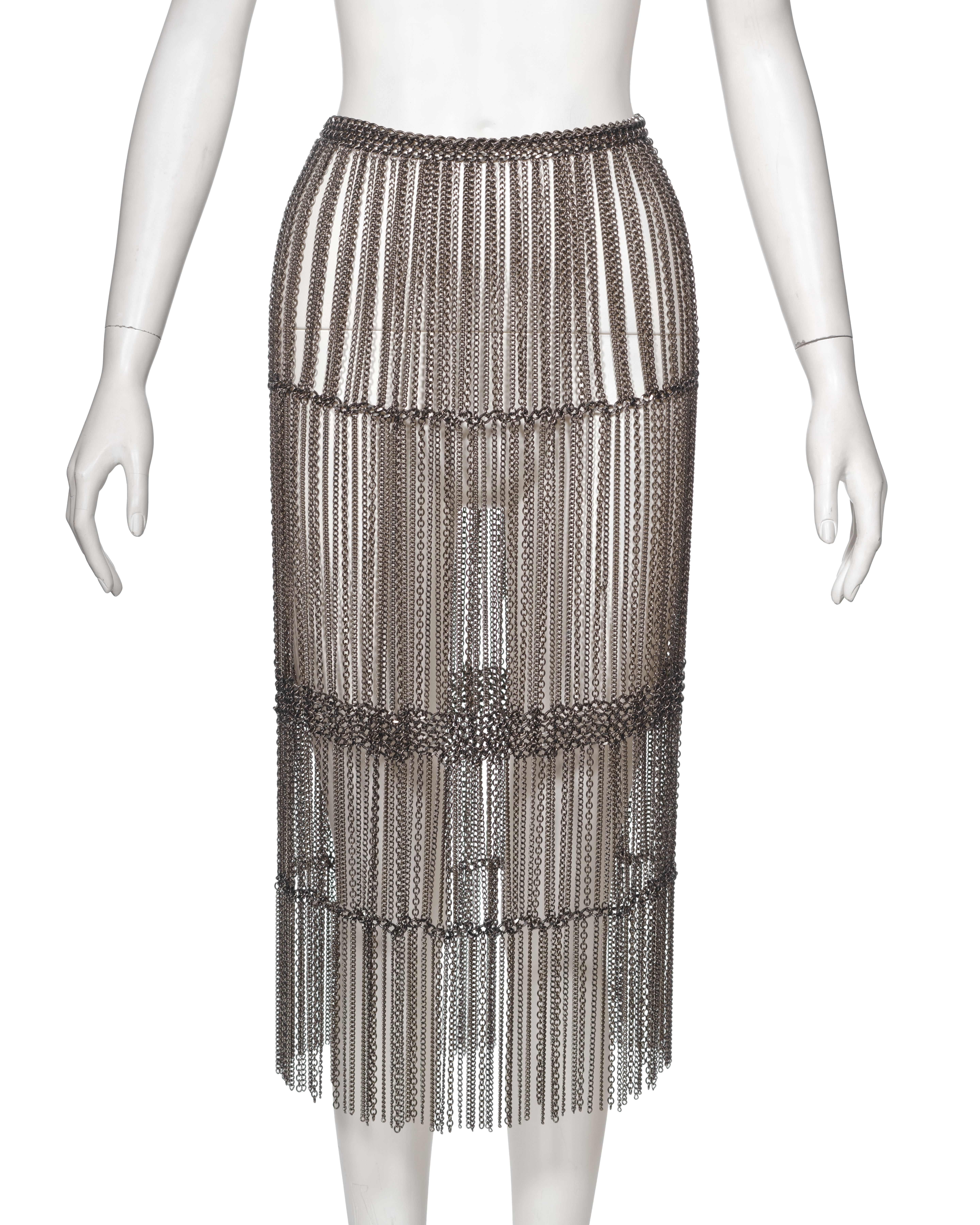 ▪ Archival Prada Metal Chain Fringed Skirt
▪ Creative Director: Miuccia Prada
▪ Fall-Winter 2002
▪ Crafted from silver-tone metal chains
▪ Robust heavyweight construction
▪ High-waisted fit for a flattering silhouette
▪ Calf-length design 
▪
